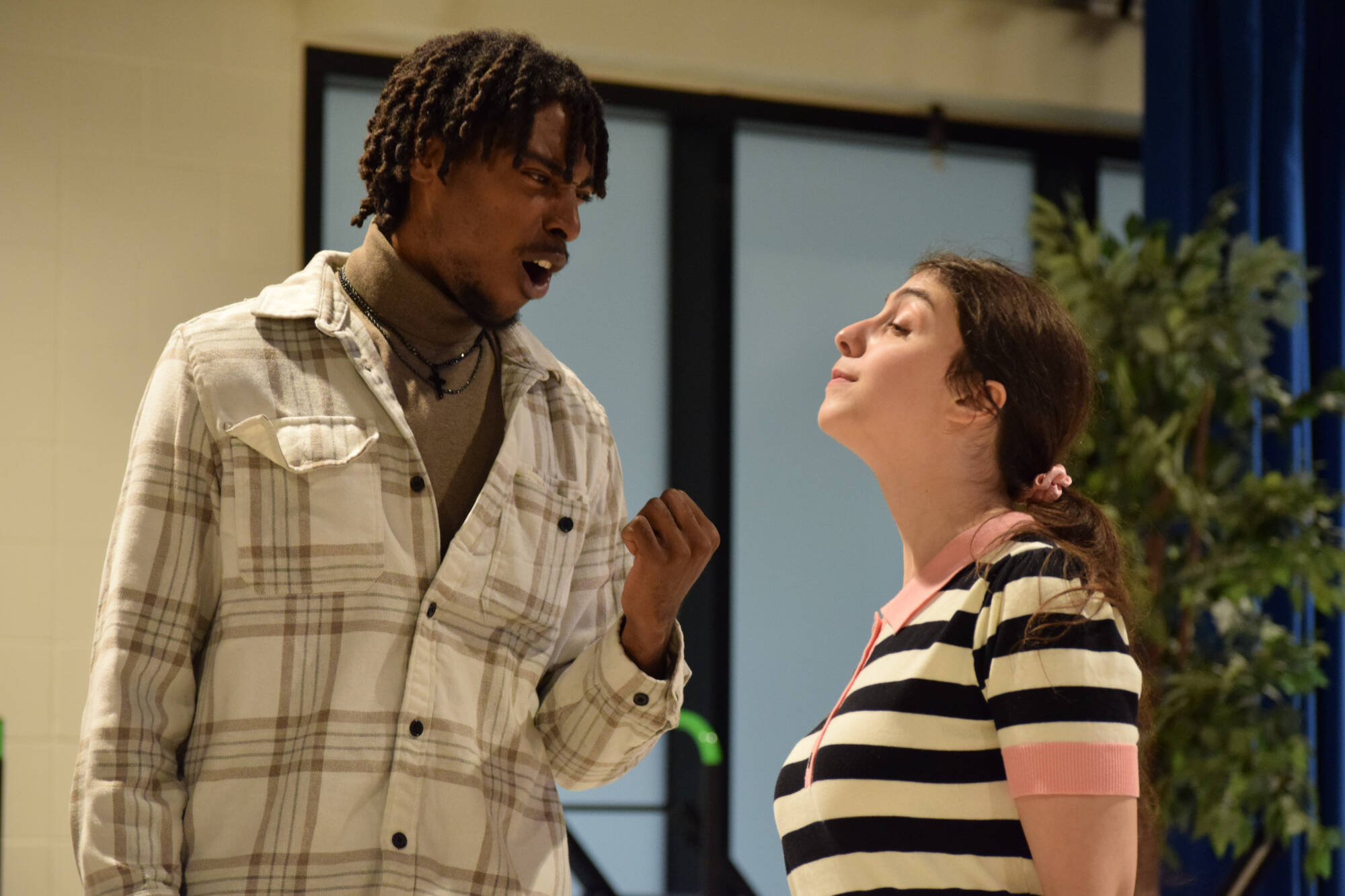 two student actors stand during a scene in a rehearsal for Midsummer Night's Dream